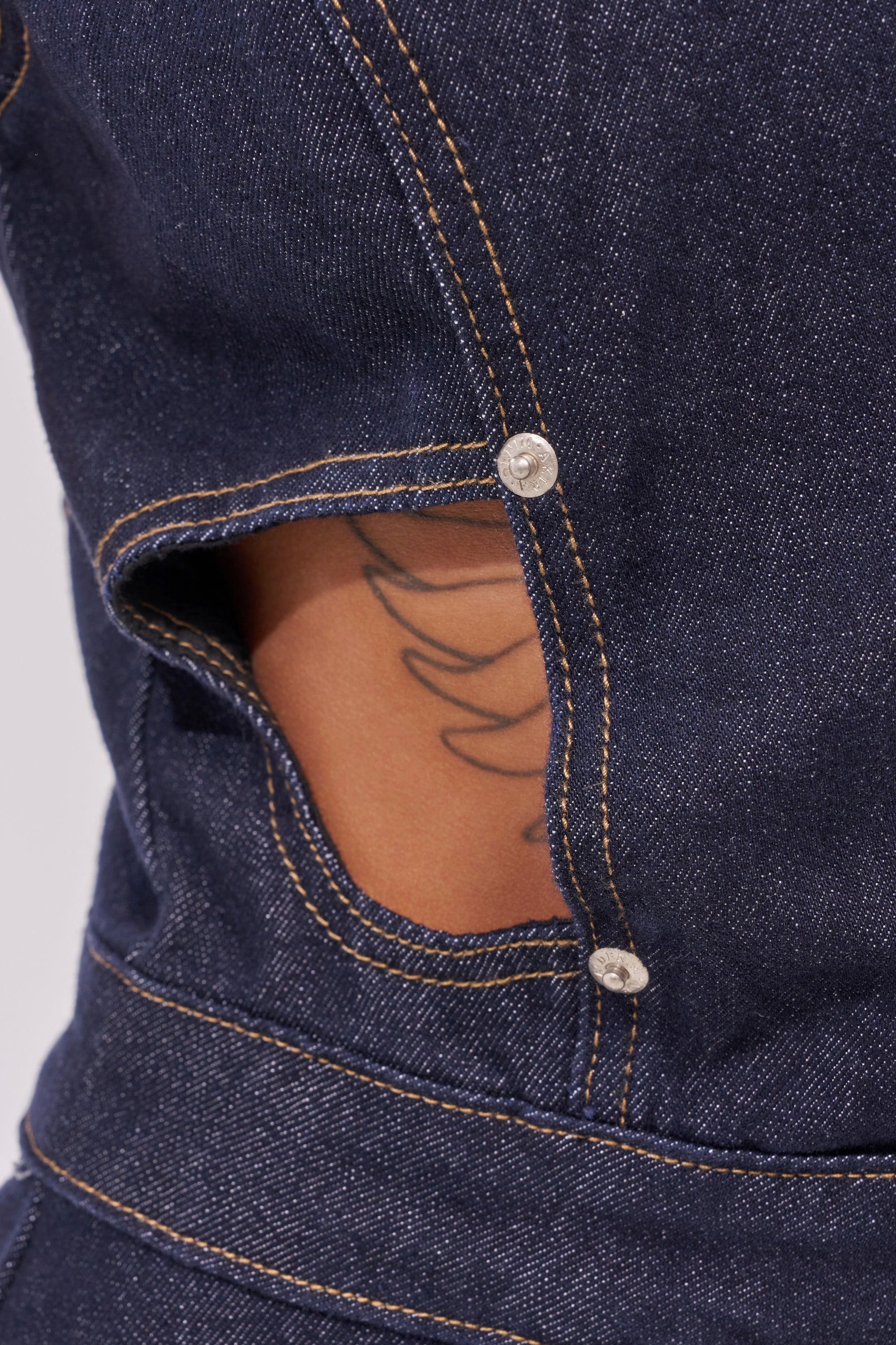 BRING THE ENERGY CUT OUT DENIM JUMPSUIT