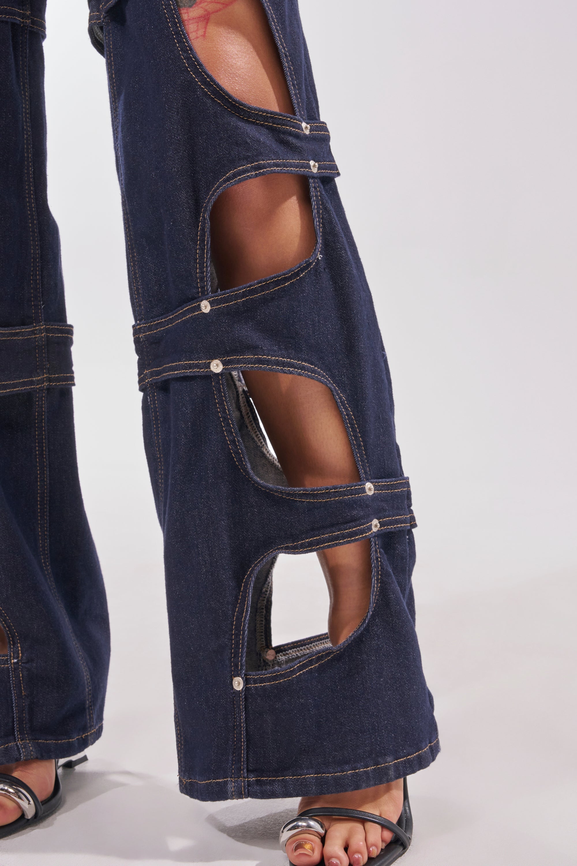 BRING THE ENERGY CUT OUT DENIM JUMPSUIT